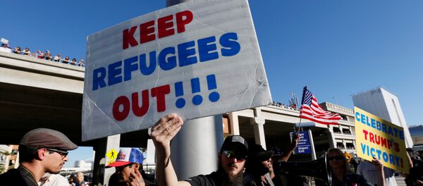 Pro-Trump demonstrators yell slogans during protest against the travel ban imposed by U.S. President Donald Trump's executive order, at Los Angeles International Airport in Los Angeles, California, U.S., January 29, 2017 Pro-Trump demonstrators yell slogans during protest against the travel ban imposed by U.S. President Donald Trump's executive order, at Los Angeles International Airport in Los Angeles, California, U.S., January 29, 2017 - Sputnik International