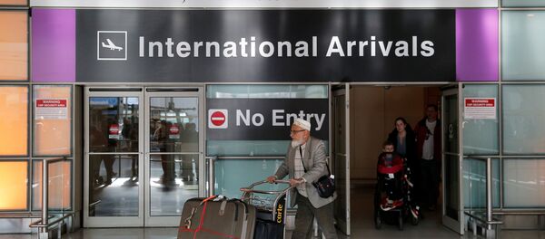 International travelers arrive after U.S. President Donald Trump's executive order travel ban at Logan Airport in Boston, Massachusetts, U.S - Sputnik International