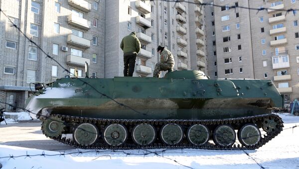 Ukrainian medical servicemen stand on an Armoured Personnel Carriers (APC) after they carried wounded servicemen to hospital in Ukraine-controlled town of Avdiivka, in Donetsk region - Sputnik International