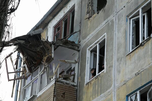A residential building damaged by an attack of the Ukrainian armed forces in Donetsk - Sputnik International