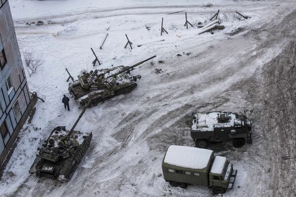 Ukrainian tanks stand in the yard of an apartment block in Avdiivka, eastern Ukraine. Fighting in the area around the town between Kiev forces and local militia escalated last week. Ukrainian tanks stand in the yard of an apartment block in Avdiivka, eastern Ukraine. Fighting in the area around the town between Kiev forces and local militia escalated last week. - Sputnik International