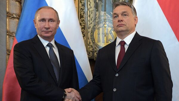 Hungarian Prime Minister Viktor Orban (R) and Russian President Vladimir Putin attend a news conference following their talks in Budapest, Hungary - Sputnik International