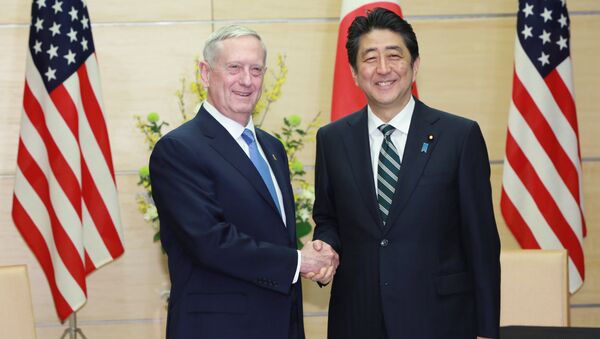 U.S. Defense Secretary Jim Mattis (L) and Japanese Prime Minister Shinzo Abe (R) shake hands at the prime minister's office in Tokyo, Japan - Sputnik International