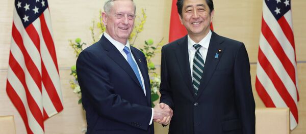 U.S. Defense Secretary Jim Mattis (L) and Japanese Prime Minister Shinzo Abe (R) shake hands at the prime minister's office in Tokyo, Japan - Sputnik International