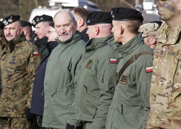 Polish Defense Minister Antoni Macierewicz, fourth right, stands with soldiers during the opening of joint Polish and U.S. exercise on training fields in Zagan, Poland, Monday, Jan. 30, 2017 Polish Defense Minister Antoni Macierewicz, fourth right, stands with soldiers during the opening of joint Polish and U.S. exercise on training fields in Zagan, Poland, Monday, Jan. 30, 2017 - Sputnik International