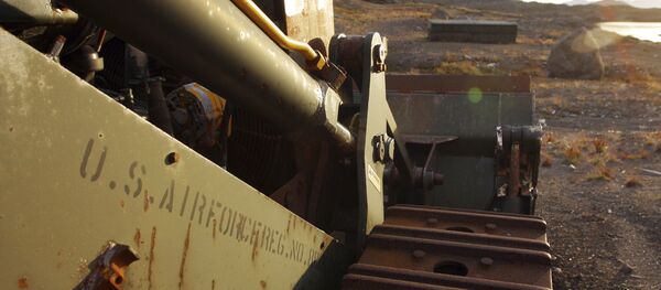 In this file photo dated Aug. 16, 2005, an abandoned US Air Force vehicle is seen on Aug. 16, 2005, outside the eastern Greenland settlement of Kulusuk where there used to be a U.S. Air Force base as part of an early warning radar system - Sputnik International