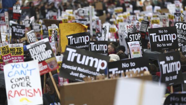 Demonstrators march against U.S. President Donald Trump and his temporary ban on refugees and nationals from seven Muslim-majority countries from entering the United States, during a protest in London, Britain, February 4, 2017 - Sputnik International