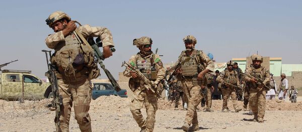 Afghan National Army commandos take position during a military operation in Helmand province (File) Afghan National Army commandos take position during a military operation in Helmand province (File) - Sputnik International