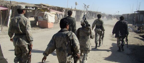 Afghan troops walk through the village of Laki , in Helmand province's Garmsir district, south of Kabul, Afghanistan (File) Afghan troops walk through the village of Laki , in Helmand province's Garmsir district, south of Kabul, Afghanistan (File) - Sputnik International