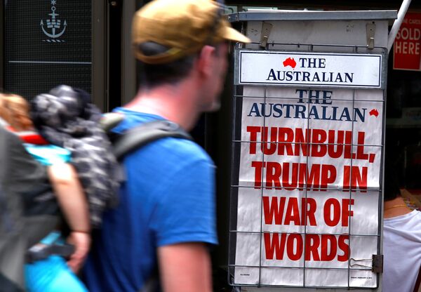A pedestrian looks at a newspaper headline regarding US President Donald Trump and Australian Prime Minister Malcolm Turnbull in central Sydney, Australia, February 3, 2017. A pedestrian looks at a newspaper headline regarding US President Donald Trump and Australian Prime Minister Malcolm Turnbull in central Sydney, Australia, February 3, 2017. - Sputnik International