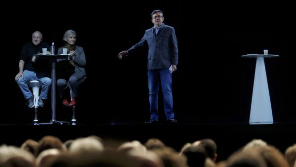 The hologram of politician Jean-Luc Melenchon (R), of the French far-left Parti de Gauche, and candidate for the 2017 French presidential election, speaks to supporters who are gathered in Saint-Denis, near Paris France, February 5, 2017 as Melenchon campaigns in Lyon - Sputnik International