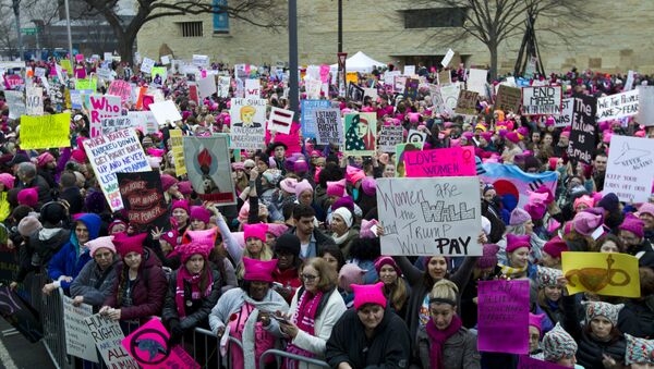 Women with bright pink hats and signs begin to gather for a protest against Donald Trump's presidency, Saturday, Jan. 21, 2017 in Washington, DC. Earlier this year, US media reported that Soros contributed $246 million to partners of the Women's March. - Sputnik International