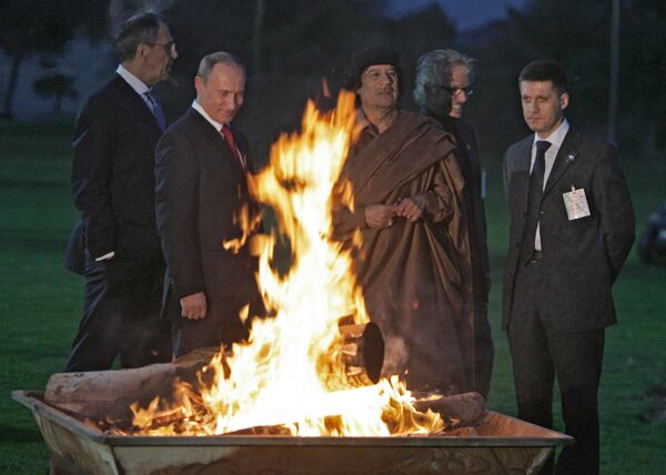 Russian President Vladimir Putin and Foreign Minister Sergei Larvov during a visit with Libyan leader Muammar Gaddafi in 2008 Russian President Vladimir Putin and Foreign Minister Sergei Larvov during a visit with Libyan leader Muammar Gaddafi in 2008 - Sputnik International