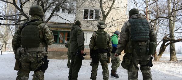Ukrainian servicemen look at a building destroyed as a result of night shelling, Avdiivka, Donetsk, on February 3, 2017 Ukrainian servicemen look at a building destroyed as a result of night shelling, Avdiivka, Donetsk, on February 3, 2017 - Sputnik International