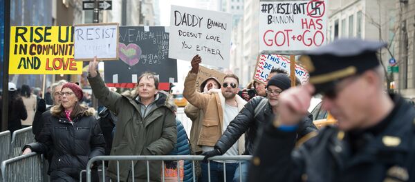 Anti-Trump protesters shout at supporters of US President Donald Trump during a rally near Trump Tower in Fifth Avenue, February 5, 2017 in New York Anti-Trump protesters shout at supporters of US President Donald Trump during a rally near Trump Tower in Fifth Avenue, February 5, 2017 in New York - Sputnik International