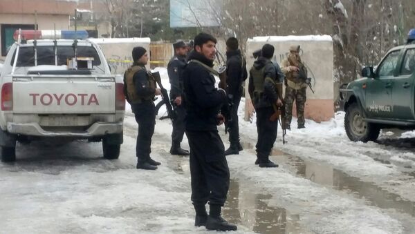 Afghan policemen keep watch at the site of a bomb blast in Kabul, Afghanistan February 7, 2017 - Sputnik International