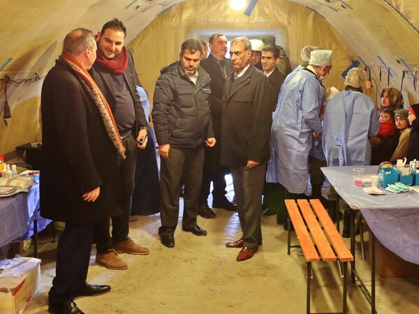 A delegation of Belgian MPs visit the temporary refugee shelter in Jibreen, Aleppo. Photo: Courtesy of The Russian Center for Reconciliation of Opposing Sides in the Syrian Arab Republic A delegation of Belgian MPs visit the temporary refugee shelter in Jibreen, Aleppo. Photo: Courtesy of The Russian Center for Reconciliation of Opposing Sides in the Syrian Arab Republic - Sputnik International