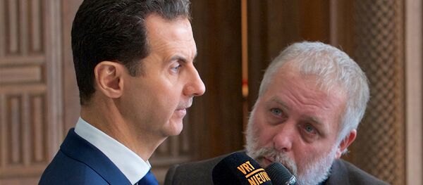 Syria's President Bashar al-Assad speaks to a group of Belgian reporters in this handout picture provided by SANA on February 7, 2017, Syria - Sputnik International