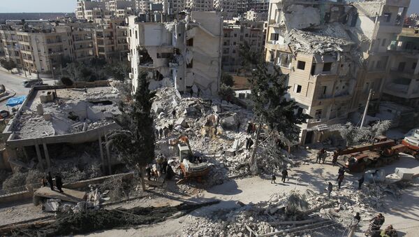 People inspect the damage at a site hit by airstrikes in the rebel-held city of Idlib, Syria February 7, 2017 - Sputnik International
