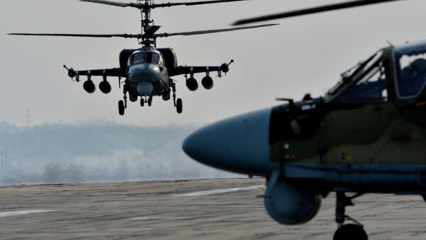 Ka-52 Alligator helicopters during tactical flight training. (File) - Sputnik International