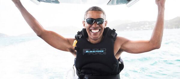 Former U.S. President Barack Obama sits on a boat during a kite surfing outing with British businessman Richard Branson during his holiday on Branson's Moskito island, in the British Virgin Islands Former U.S. President Barack Obama sits on a boat during a kite surfing outing with British businessman Richard Branson during his holiday on Branson's Moskito island, in the British Virgin Islands - Sputnik International