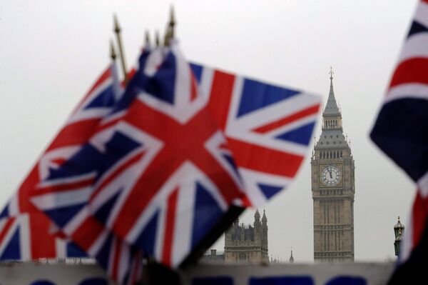 Union flags displayed on a tourist stall, backdropped by the Houses of Parliament and Elizabeth Tower containing the bell know as Big Ben, in London, Wednesday, February 8, 2017.  - Sputnik International