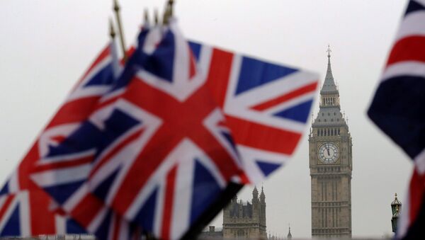 Union flags displayed on a tourist stall, backdropped by the Houses of Parliament and Elizabeth Tower containing the bell know as Big Ben, in London, Wednesday, February 8, 2017. - Sputnik International