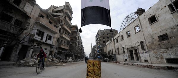 A Syrian national flag hangs in a damaged neighbourhood in Aleppo, Syria January 30, 2017 - Sputnik International