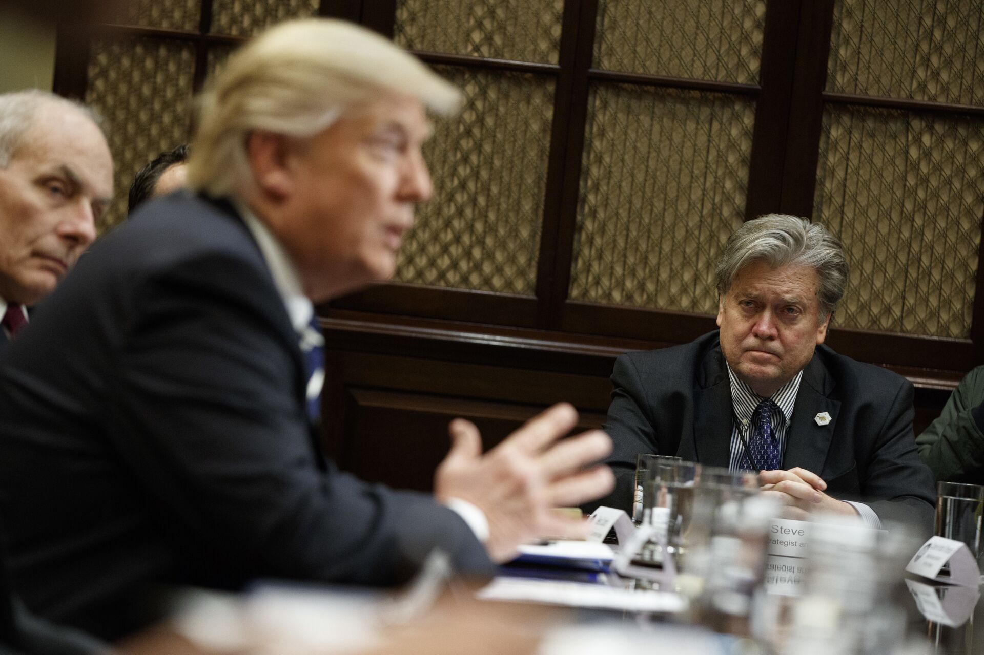White House Chief Strategist Steve Bannon listens at right as President Donald Trump speaks during a meeting on cyber security in the Roosevelt Room of the White House in Washington, Tuesday, Jan. 31, 2017. - Sputnik International, 1920, 21.10.2021