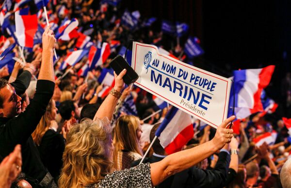 People cheer as Marine Le Pen, French National Front (FN) political party leader and candidate for the French 2017 presidential election, attends the 2-day FN political rally to launch the presidential campaign in Lyon, France February 5, 2017. People cheer as Marine Le Pen, French National Front (FN) political party leader and candidate for the French 2017 presidential election, attends the 2-day FN political rally to launch the presidential campaign in Lyon, France February 5, 2017. - Sputnik International