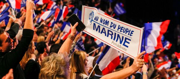 People cheer as Marine Le Pen, French National Front (FN) political party leader and candidate for the French 2017 presidential election, attends the 2-day FN political rally to launch the presidential campaign in Lyon, France February 5, 2017. People cheer as Marine Le Pen, French National Front (FN) political party leader and candidate for the French 2017 presidential election, attends the 2-day FN political rally to launch the presidential campaign in Lyon, France February 5, 2017. - Sputnik International
