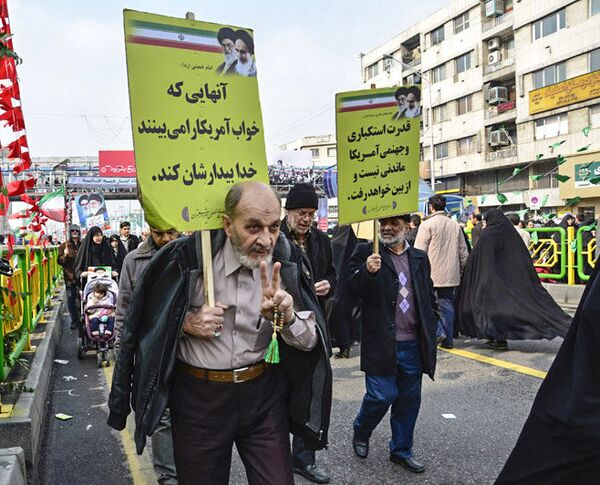 Iranians marching during rally in Tehran Iranians marching during rally in Tehran - Sputnik International