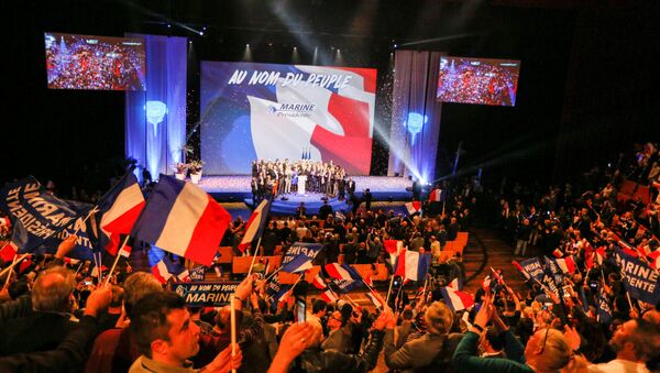 People cheer as Marine Le Pen, French National Front (FN) political party leader and candidate for the French 2017 presidential election, attends the 2-day FN political rally to launch the presidential campaign in Lyon, France February 5, 2017. - Sputnik International