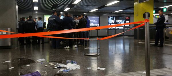 Police officers stand guard inside Tsim Sha Tsui subway station in Hong Kong, China Police officers stand guard inside Tsim Sha Tsui subway station in Hong Kong, China - Sputnik International