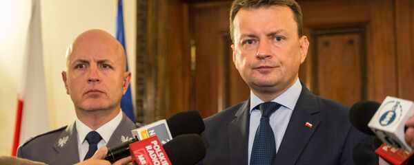 Poland's Interior Minister Mariusz Blaszczak (R) speaks during a press conference at the Polish Embassy in London. (File) Poland's Interior Minister Mariusz Blaszczak (R) speaks during a press conference at the Polish Embassy in London. (File) - Sputnik International