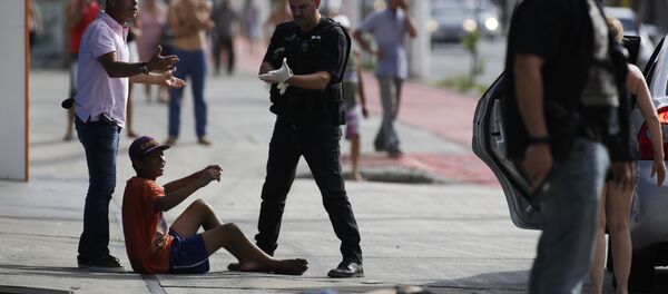 Civil police detain looters after they were shot in their legs, in Vitoria, Espirito Santo state, Brazil, Monday, Feb 6, 2017. Protests by the friends and family of military police in Espirito Santo have led to an increase in crime and forced the shut-down of some state services, authorities said Monday. Civil police detain looters after they were shot in their legs, in Vitoria, Espirito Santo state, Brazil, Monday, Feb 6, 2017. Protests by the friends and family of military police in Espirito Santo have led to an increase in crime and forced the shut-down of some state services, authorities said Monday. - Sputnik International