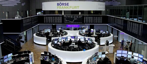Traders work at their desks in front of the German share price index, DAX board, at the stock exchange in Frankfurt, Germany, January 17, 2017 Traders work at their desks in front of the German share price index, DAX board, at the stock exchange in Frankfurt, Germany, January 17, 2017 - Sputnik International