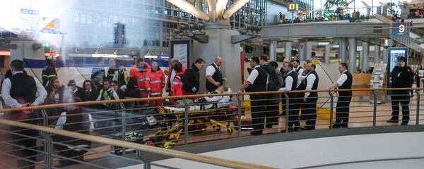 Firefighters take care of a person on a stretcher inside Hamburg airport on February 12, 2017 in Hamburg, northern Germany, as German emergency services evacuated the airport after people reported an unusual smell as well as respiratory ailments and watering eyes Firefighters take care of a person on a stretcher inside Hamburg airport on February 12, 2017 in Hamburg, northern Germany, as German emergency services evacuated the airport after people reported an unusual smell as well as respiratory ailments and watering eyes - Sputnik International