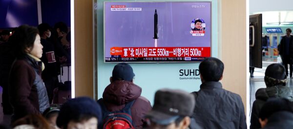Passengers watch a TV screen broadcasting a news report on North Korea firing a ballistic missile into the sea off its east coast, at a railway station in Seoul, South Korea, February 12, 2017 Passengers watch a TV screen broadcasting a news report on North Korea firing a ballistic missile into the sea off its east coast, at a railway station in Seoul, South Korea, February 12, 2017 - Sputnik International