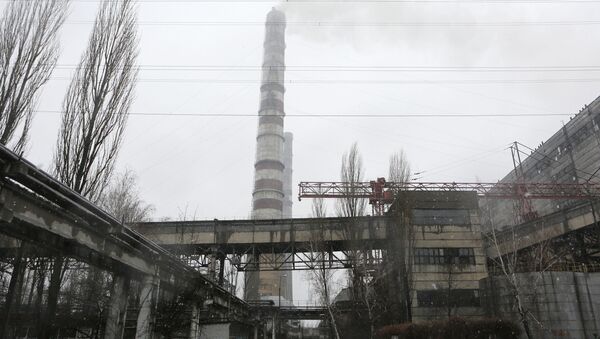 Steam rises from a smokestack at the Trypillya thermal power plant in Ukrainka, about 50 kilometers (31.3 miles) south of Kiev, Ukraine, Thursday, Feb. 11, 2016 - Sputnik International