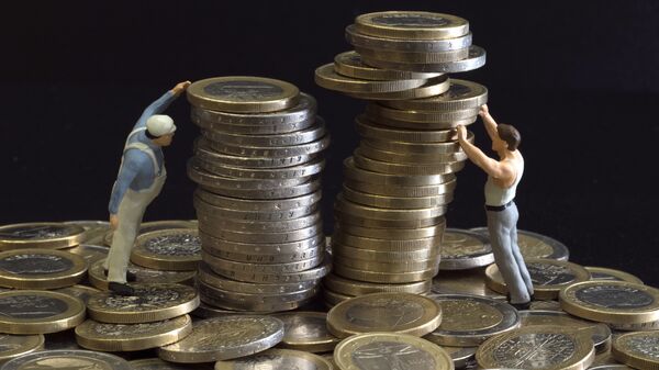 Picture taken on July 26, 2012 in Paris shows an illustration made with figurines and euro coins - Sputnik International