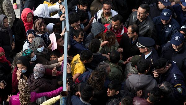 Refugees and migrants, most of them Afghans, block the entrance of the refugee camp at the disused Hellenikon airport as police officers try to disperse them, in Athens, Greece, February 6, 2017 - Sputnik International