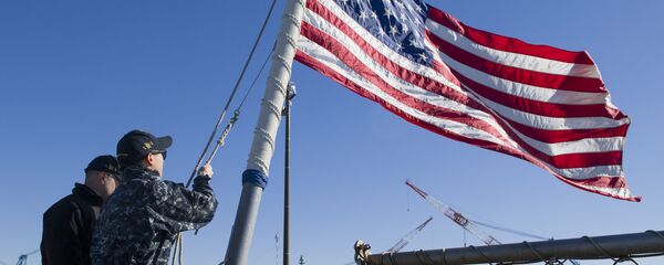 Sailors assigned to the Arleigh Burke-class guided-missile destroyer USS John S. McCain (DDG 56) lower the ensign as the ship gets under way for a routine patrol. McCain is forward deployed to the U.S. 7th Fleet area of responsibility in support of security and stability in the Indo-Asia-Pacific region Sailors assigned to the Arleigh Burke-class guided-missile destroyer USS John S. McCain (DDG 56) lower the ensign as the ship gets under way for a routine patrol. McCain is forward deployed to the U.S. 7th Fleet area of responsibility in support of security and stability in the Indo-Asia-Pacific region - Sputnik International
