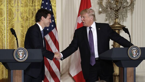 President Donald Trump shakes hands with Canadian Prime Minister Justin Trudeau during their joint news conference in the East Room of the White House - Sputnik International
