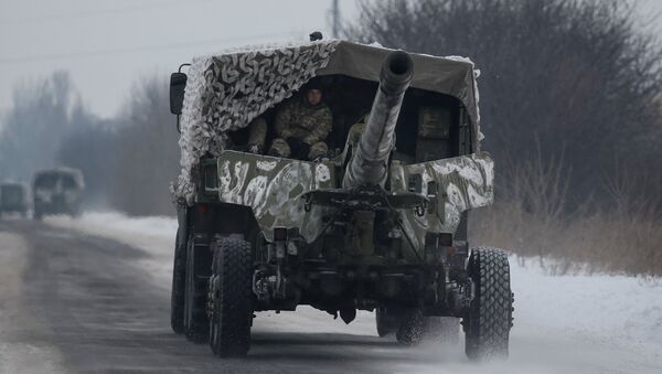 A military vehicle with cannon is seen near the government-held industrial town of Avdiyivka, Ukraine, February 2, 2017 - Sputnik International