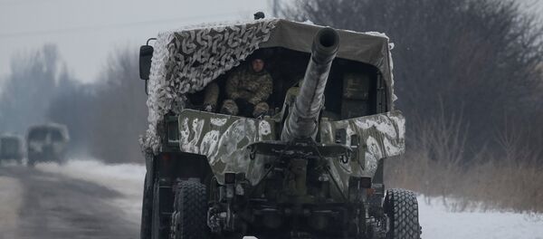 A military vehicle with cannon is seen near the government-held industrial town of Avdiyivka, Ukraine, February 2, 2017 - Sputnik International