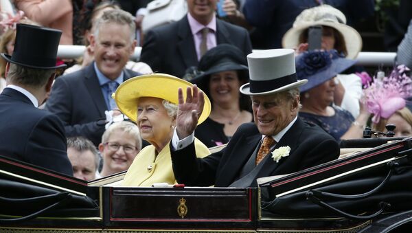 Britain's Queen Elizabeth II, looks up as Prince Philip, right, waves during their arrival by carriage on the first day of the Royal Ascot horse race meeting at Ascot, England, Tuesday, June, 14, 2016 - Sputnik International