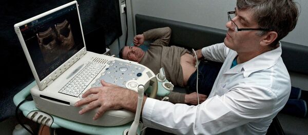 A doctor performs ultrasound scans in the ultrasound room A doctor performs ultrasound scans in the ultrasound room - Sputnik International