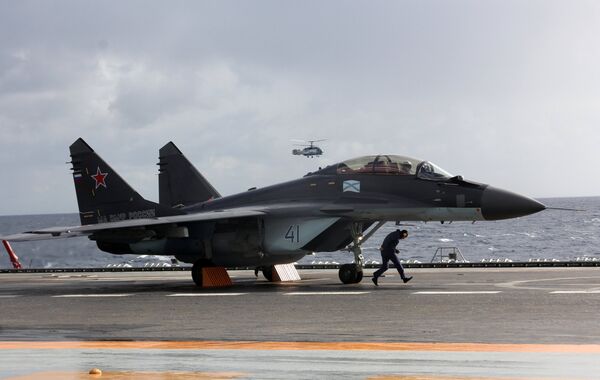 MiG-29K fighter aboard Admiral Kuznetsov heavy aircraft carrier in the Mediterranean Sea. File photo  - Sputnik International