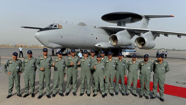 Indian Air Force (IAF) officers and crew of the Airborne Warning and Control System (AWACS) aeroplane pose for the media during the induction ceremony of the first AWACS equipped IL-76 aircraft at Air Foce station in New Delhi - Sputnik International